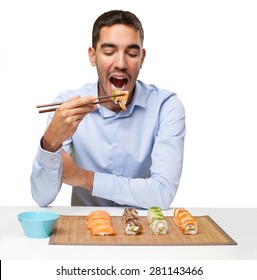 Young Man Eating Sushi