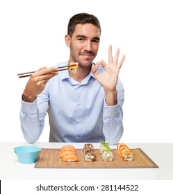 Young Man Eating Sushi