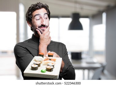 Young Man Eating Sushi