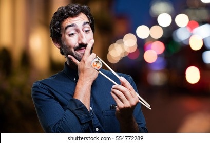 Young Man Eating Sushi