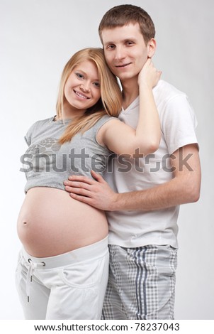 Similar – Pregnant woman embraced by her husband