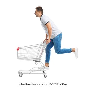 Young Man With Empty Shopping Cart On White Background