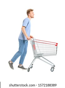 Young Man With Empty Shopping Cart On White Background