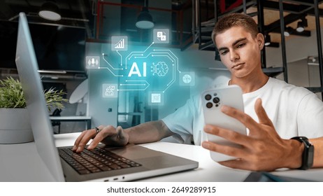 Young man engaged in artificial intelligence research while using a laptop and smartphone in a modern office space