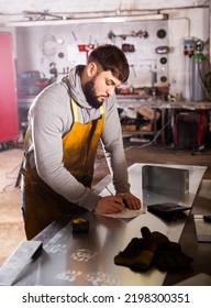 Young Man Engineer Calculation Size Of Material In Workshop