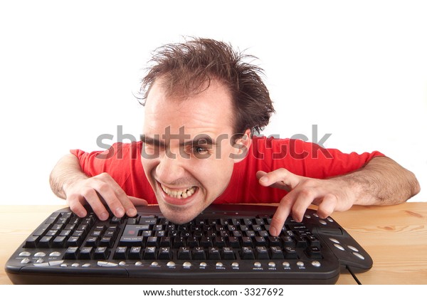 A young man enjoying a computer game on white background