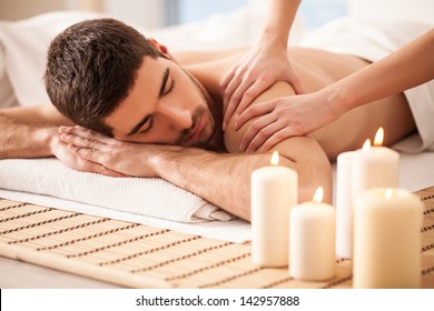 Young man enjoying a massage.