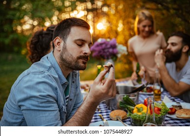 Young man enjoying a piece of food