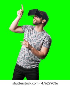 young man enjoying with a virtual reality glasses
