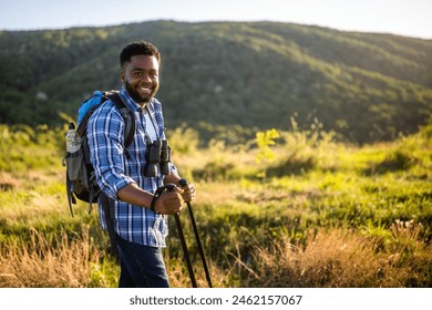 Young man enjoys hiking in nature. - Powered by Shutterstock