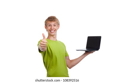 Young man excited smile hold laptop show hand thumb up gesture, looking at camera, casual wear green shirt isolated over white background, concept of present advertise - Powered by Shutterstock