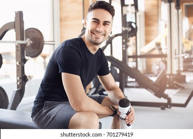 Young Man Exercise In The Gym Healthy Lifestyle