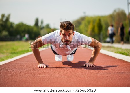 Similar – Jogger stretching in the morning on seaside.