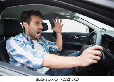 Young Man Experiencing Road Rage In His Car