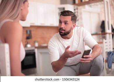 Young Man Explaining Something To His Wife