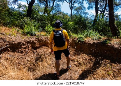 Young Man Exploring New Places In Nature, Hiking In Forest, Nature And Freedom, Rear View, Selective Focus Included.