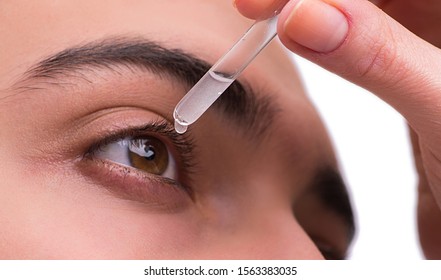 Young man in eye care medical concept - Shutterstock ID 1563383035