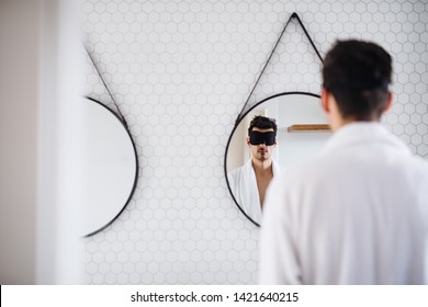 Young Man With Eye Mask In The Bathroom In The Morning.