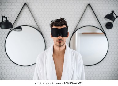 Young Man With Eye Mask In The Bathroom In The Morning.