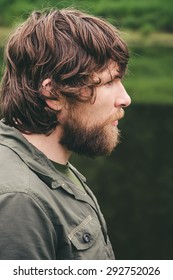 Young Man Face Bearded Curly Hair Portrait Outdoor Lifestyle Travel Concept Nature On Background Side View