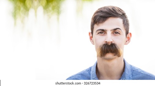 Young man with fake mustaches. Dental health concept.