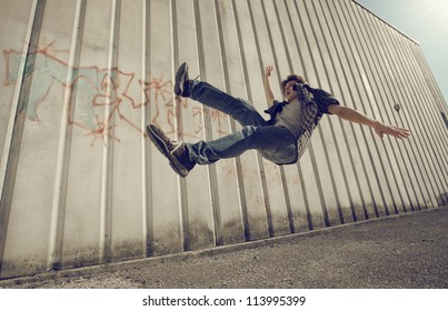 Young man falling from a building