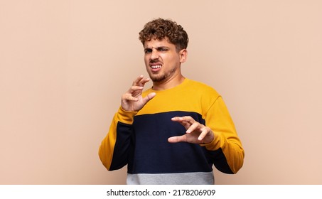 Young Man Feeling Disgusted And Nauseous, Backing Away From Something Nasty, Smelly Or Stinky, Saying Yuck