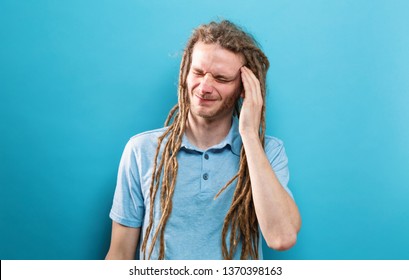 Young Man Feeling Stressed On A Solid Background