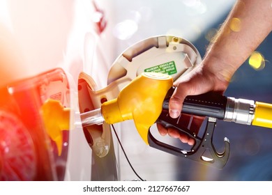 Young man, fill diesel tank of car after finish refill diesel oil in gas station
