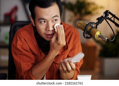 Young Man Filming Himself Covering Undereye Circles With New Full Coverage Concealer