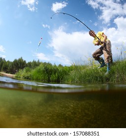 Young Man Fishing In A Pond In A Sunny Day