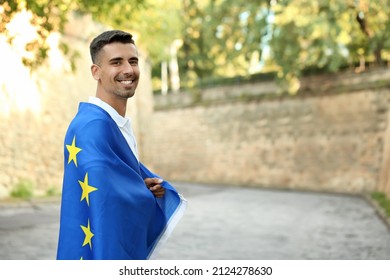 Young Man With Flag Of European Union Outdoors