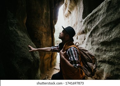 A Young Man Geologist Explores A Mountain Cave, Travel Concept