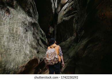 A Young Man Geologist Explores A Mountain Cave, Travel Concept