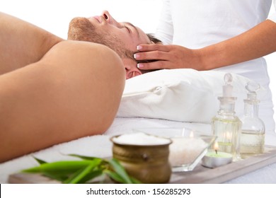 Young Man Getting Scalp Massage And Relaxing