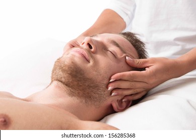 Young Man Getting Scalp Massage And Relaxing