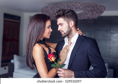 Young Man Give Rose To Lover Indoor, Couple In Love