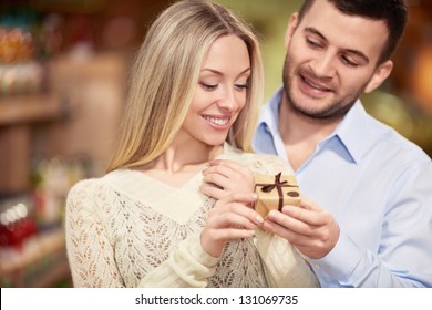 Young Man Gives A Woman Gift