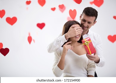 Young Man Giving A Gift