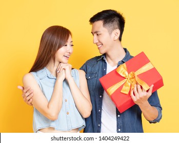 Young Man Giving  Present To His Girlfriend