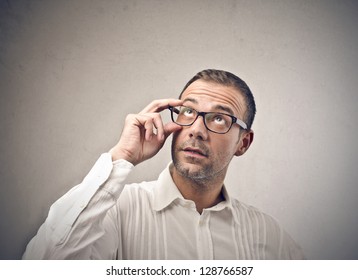 Young Man With Glasses Looking Up