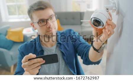 Similar – Image, Stock Photo Two surveillance cameras on the corner of a house