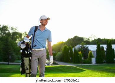 Young man with a golf bag