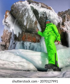 Young Man In A Green Suit. Ski Suit. A Guy On The Ice Of Baikal In A Ski Suit.