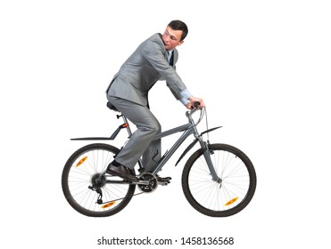 Young Man In Grey Business Suit On Bike. Handsome Businessman Riding Bicycle. Male Cyclist Looking Back Isolated On White Background. Eco Friendly Personal Vehicle To Work Concept.