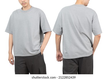 Young man in grey oversize t-shirt mockup front and back used as design template, isolated on white background with clipping path. - Shutterstock ID 2122852439
