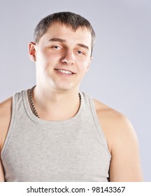 Young man in grey t-shirt studio shot - Shutterstock ID 98143367