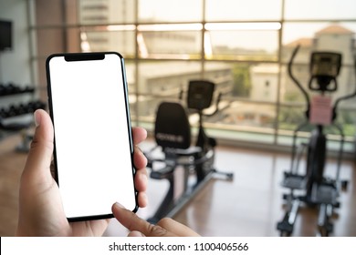 Young Man Hand Holding Smartphone In Gym To  Fitness Phone Fitness Exercise Concept