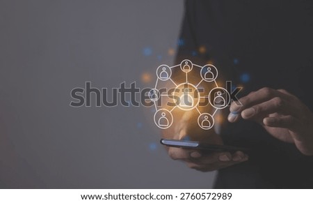Young man hand using smartphone to Interconnect, Interconnected Concept; People connect via wireless internet in a world of digital technology and communications that connect freely around the world