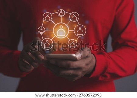 Young man hand using smartphone to Interconnect, Interconnected Concept; People connect via wireless internet in a world of digital technology and communications that connect freely around the world